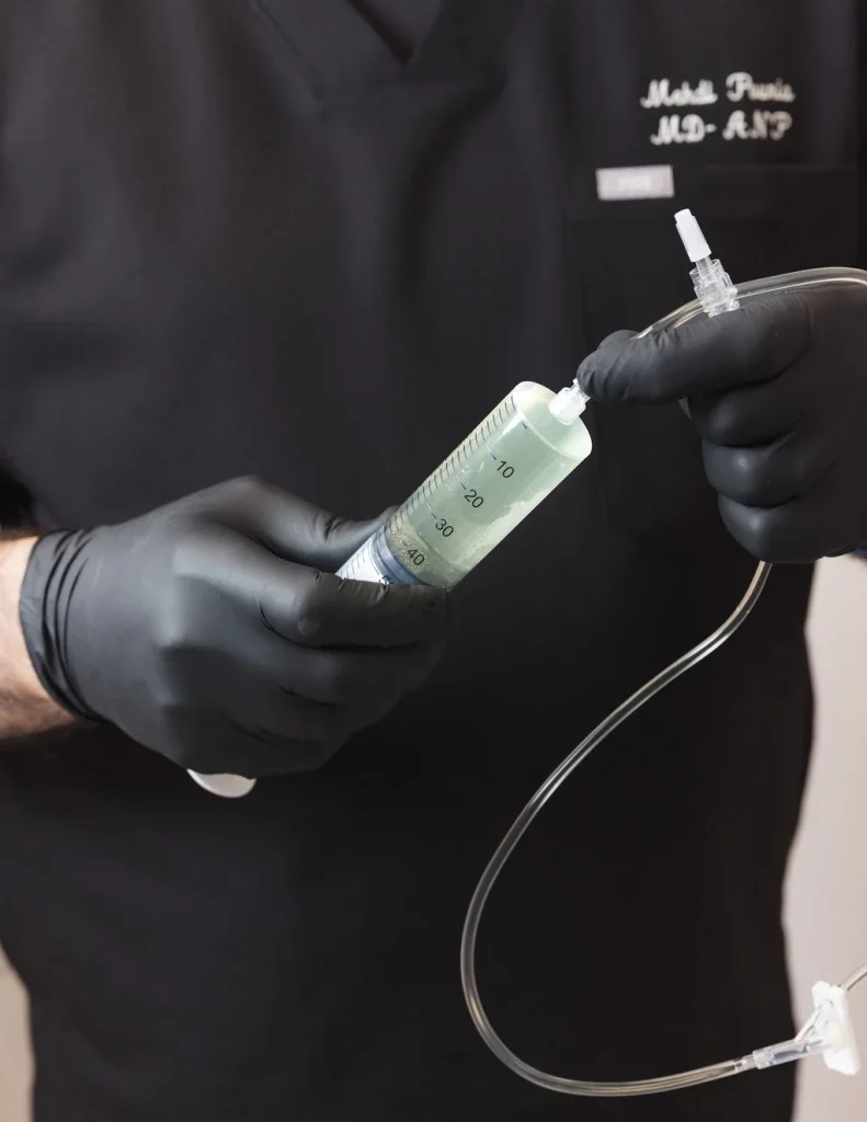 Professional preparing IV solution before injection